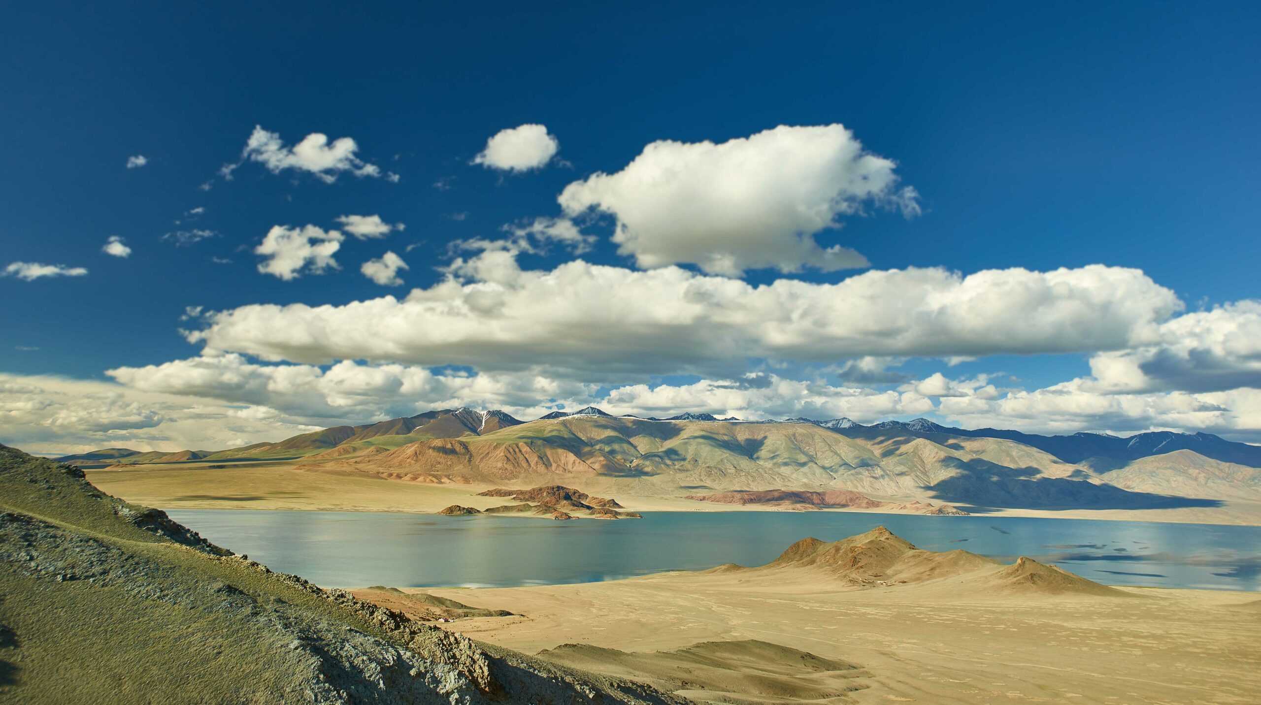 Mountain lake surrounded by forest reflecting water monitoring use case